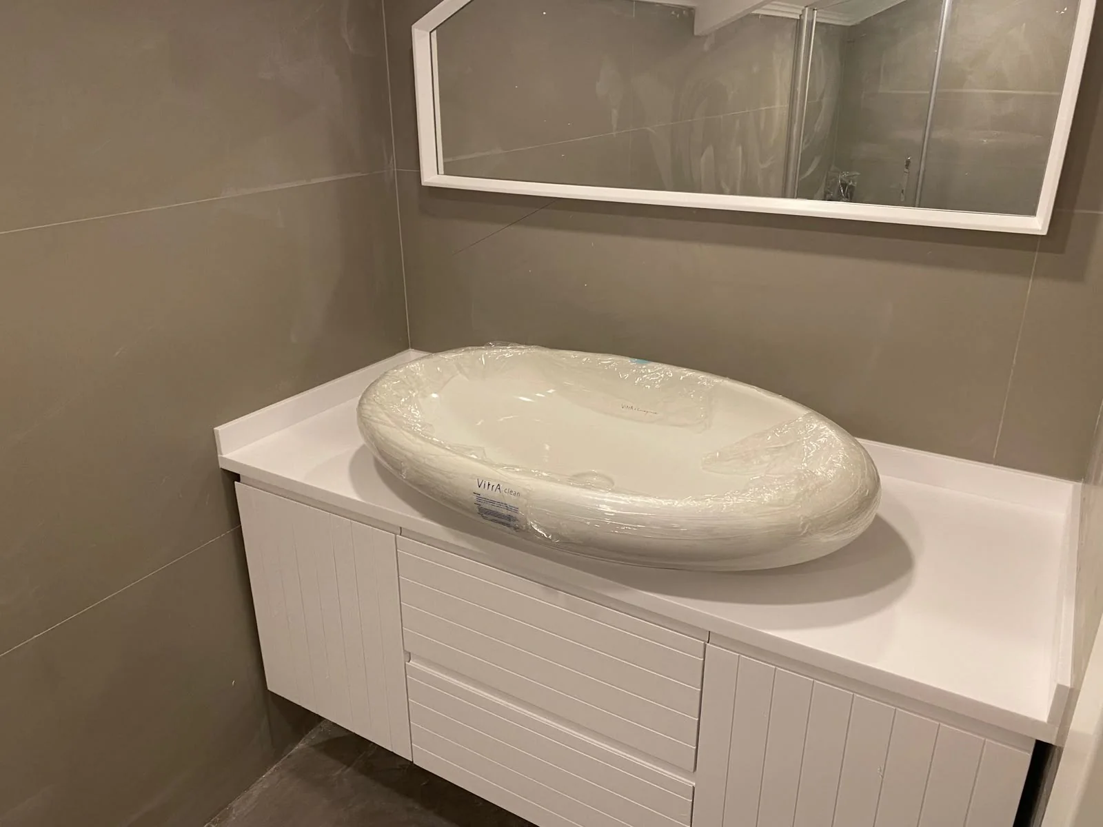 Bathroom countertop and vanity installation — image 09